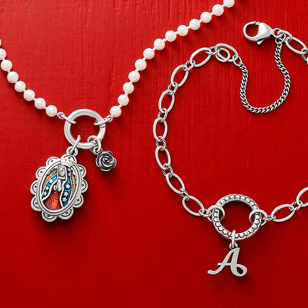 Silver charm holder necklaces with charms.