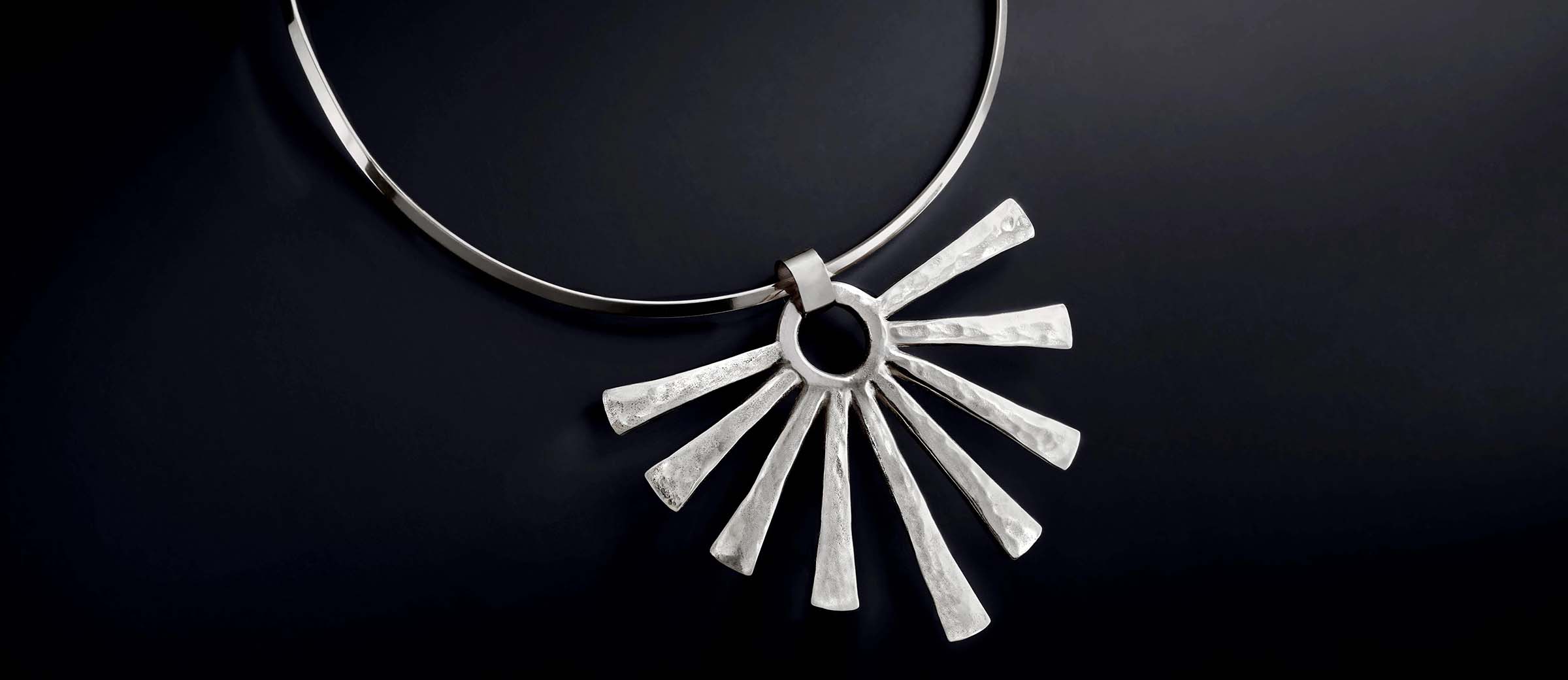 Sterling silver Sunburst Pendant with Collet Neck Collar on a black background