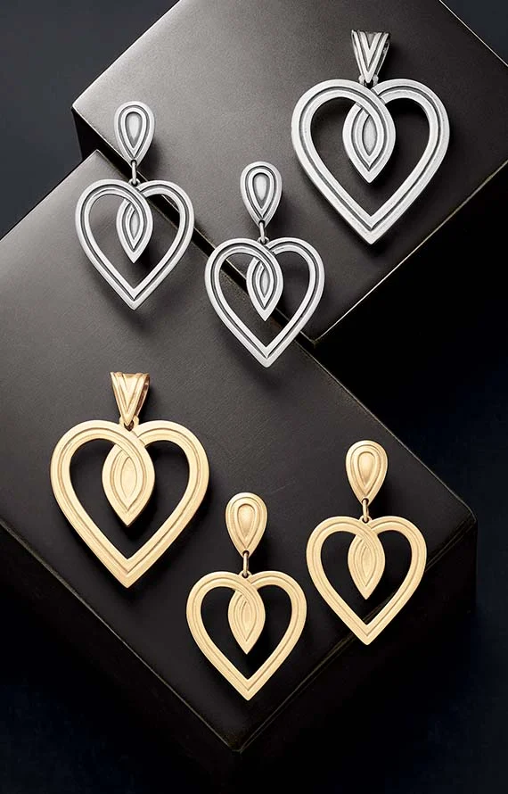 From the Heart Pendant and Ear Posts, shown in sterling silver and 14K gold on a black background