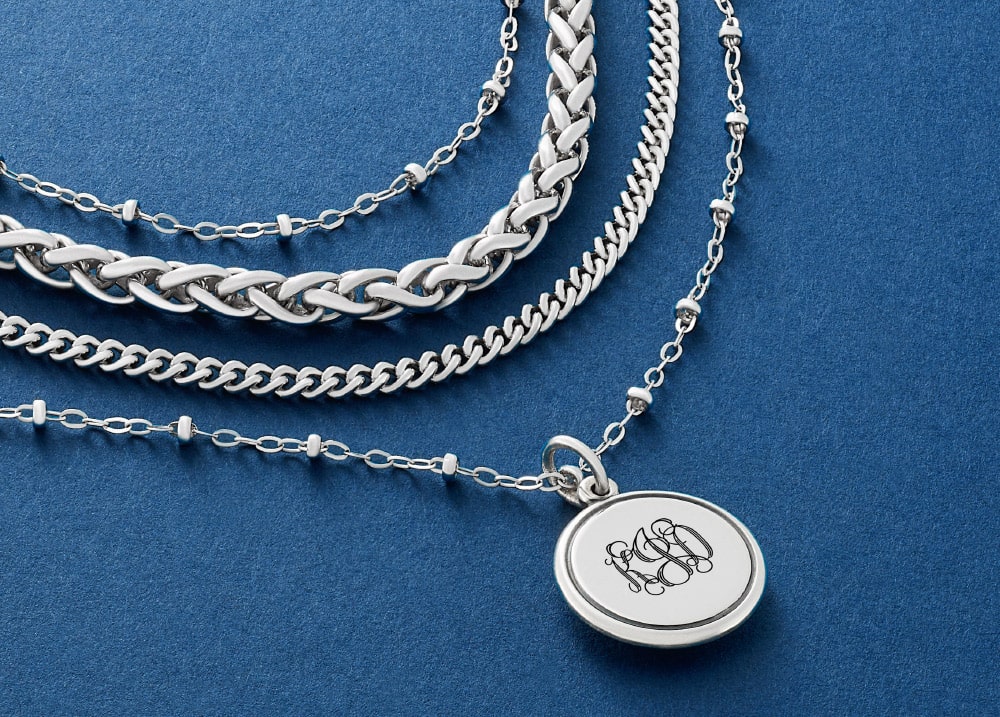 Layered sterling silver necklaces and engravable disk